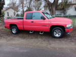 1998 Dodge Ram truck with engine issues and minor body dents, great for mechanics or parts.