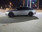 Silver 2007 Audi A4 Quattro with black wheels parked at night