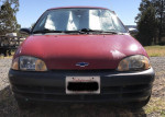 Front view of a 1998 Chevrolet Metro hatchback with 100,000 miles, showcases its condition and characteristics.