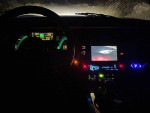 Interior view of a 1987 Chevrolet Corvette showcasing dashboard controls and multimedia system.