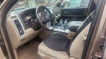 Interior view of a 2010 Dodge Ram 1500 Big Horn with clean seats and steering wheel