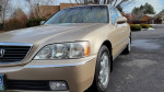 1999 Acura RL with low mileage, well-maintained and clean exterior in a driveway setting