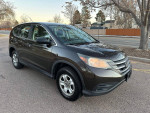 2013 Honda CR-V in good condition, featuring 4WD, automatic transmission, clean interior, and exterior with minor hail spots.