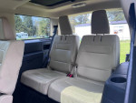 Interior view of a 2014 Ford Flex SEL showing spacious rear seating for seven passengers.