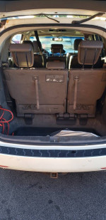 Interior view of 2012 Honda Odyssey Touring van with rear seats folded down and cargo space visible.