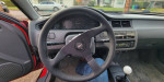 Interior view of a 1993 Honda Civic DX showcasing steering wheel and controls.