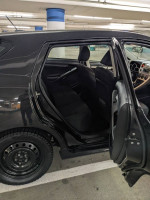 Interior view of 2011 Toyota Matrix with black seats and steel wheels, for sale with low mileage.