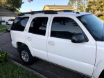 2005 Chevrolet Tahoe Z71 4WD parked, showcasing its white exterior and tinted windows.