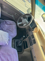 Interior view of a Honda Passport with stick shift, featuring clean seats and dashboard.