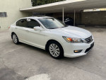 2015 Honda Accord EXL with 62,000 miles, white color, parked with clean exterior and stylish design.