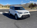 2014 Kia Soul in white, well-maintained with a clean interior, parked in a scenic area, features alloy wheels.