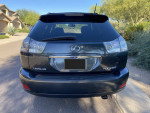 Rear view of a 2009 Lexus RX350 in excellent condition with no accidents, featuring clean title and updated service.