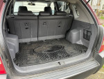 Rear view of 2005 Hyundai Tucson's spacious hatchback interior with seating and cargo area