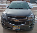 2015 Chevrolet Equinox L FWD parked outside, showcasing its sleek design and excellent condition.