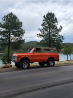 1971 Chevrolet K5 Blazer, LS swapped, parked near a lake with trees in the background.