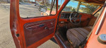 Interior view of a vintage 1976 Ford F250 truck, showcasing the dashboard and seats.