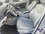 Interior view of a 2010 Toyota Prius with leather seats and clean dashboard, showcasing its well-maintained condition.