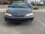 Front view of a gray 2000 Toyota Camry with 157k miles, showcasing its clean condition and reliable design.