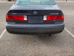 2000 Toyota Camry rear view with V6 badge, showcasing clean design and good condition.