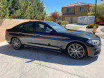 2018 BMW 540d xDrive in black with M Sport package, showcasing low mileage and sleek design.