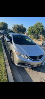 2015 Honda Civic SE FWD in silver, featuring a sunroof, reverse camera, and stylish rims with low mileage.