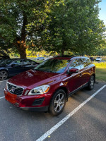 2011 Volvo XC60 T6 3.0 in red parked outdoors with clean exterior and nearby trees