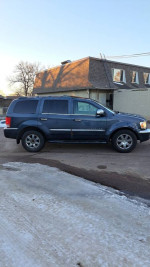 Side view of a Chrysler Aspen SUV for sale with 136,000 miles and new tie rods, brakes, and seats.