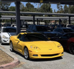 2005 Chevrolet Corvette in a parking lot, yellow exterior, well-maintained and ready for sale.