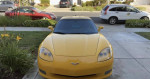 2005 Chevrolet Corvette in yellow, parked with clean exterior and well-maintained interior, showcasing reliability and style.