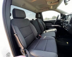 Interior view of a 2014 Chevrolet Silverado 1500 LT with spacious front seating and modern dashboard.