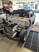1967 Chevrolet Camaro RS Coupe stripped down, ready for body work in garage
