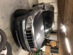 2012 Jeep Grand Cherokee 4x4 Limited in garage, showcasing off-road capability and towing features.