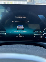 Dashboard view of 2024 BMW 430i showing total mileage and refuel data