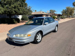 1999 Oldsmobile Intrigue GL in good condition, silver sedan on a sunny street with clean AZ title.