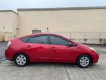 2007 Toyota Prius hybrid car in red, low mileage, ideal for deliveries and road trips, reliable and economical vehicle.