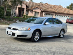 2013 Chevrolet Impala LTZ in silver with leather interior and moonroof, parked in residential area