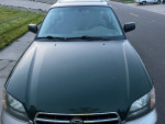 Front view of 2002 Subaru Legacy Outback in green color with excellent condition and low mileage.