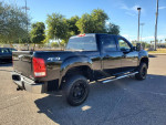 2013 GMC Sierra Crew Cab 4X4 for sale, black exterior, 162K miles, freshly painted and ready for purchase.