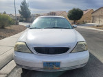 Front view of a 2002 Mercury Sable for sale, showing minor scratches and new tires.