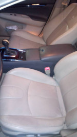 Interior view of a well-maintained 2010 Infiniti G37 showing front seats and console.