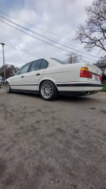 1989 BMW E34 535i with clean title and 215,000 miles, parked outdoors, showcasing its sleek exterior and BBS wheels.