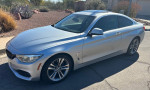 2015 BMW 435i silver coupe with black leather interior, showcasing stylish design and advanced features