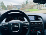 Interior view of a 2012 Audi A5 with navigation and modern dashboard features.