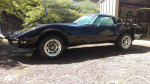 1973 Chevrolet Corvette Stingray in black, showcasing its classic design and rebuilt 350 engine.