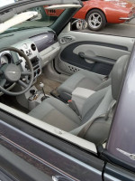 Interior view of a 2007 PT Cruiser Convertible showcasing low mileage and updated features.
