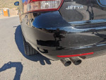 Rear view of a 2013 Volkswagen Jetta TDI showcasing the dual exhaust and sleek design.
