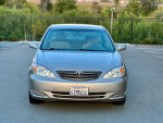 2002 Toyota Camry SE in excellent condition, with low mileage and clean title, parked outdoors.