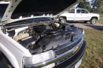 2005 Chevrolet Suburban engine view with hood open, showcasing V8 engine and maintenance details
