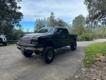 2006 Chevrolet Silverado 2500HD 4x4 with 129k miles, clean title, mud tires, and recent maintenance.