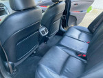 Interior view showing the spacious back seats of a 2008 Lexus ES 350 with black leather upholstery.
